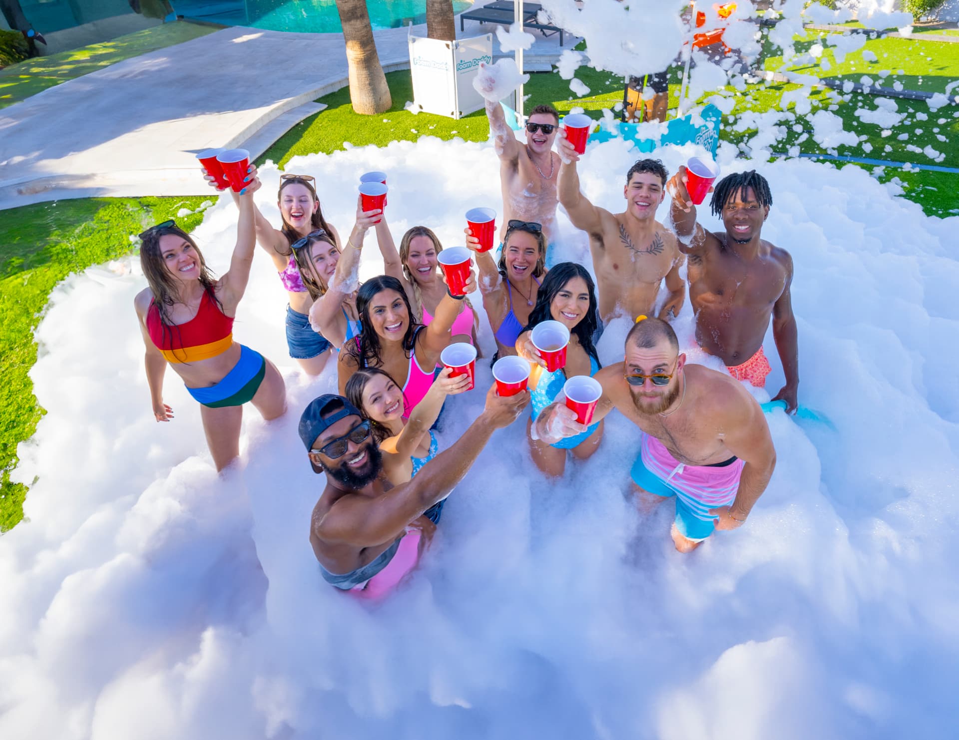 College students celebrating together in deep foam at a Cincinnati foam party