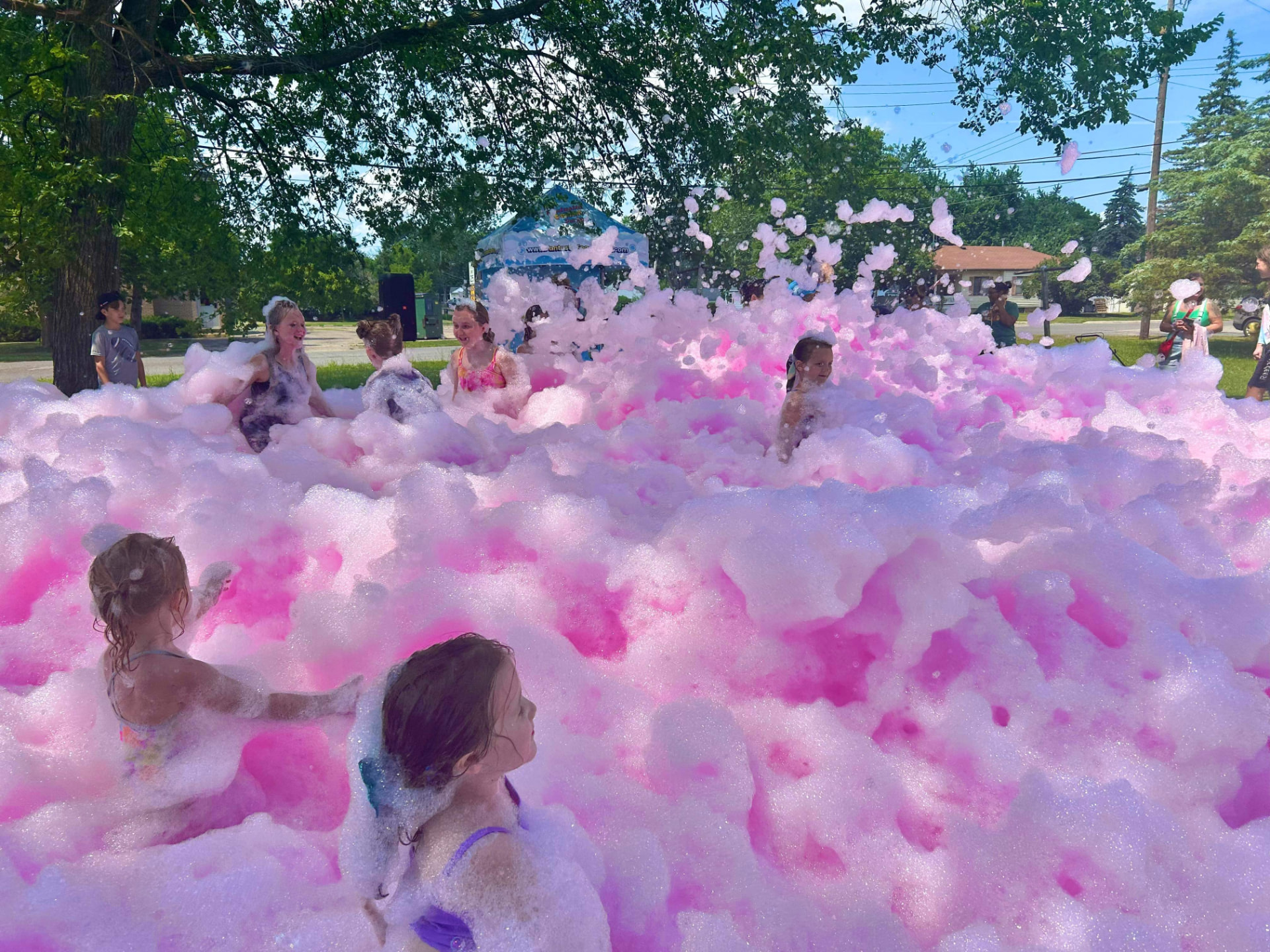 Kids playing in bright pink color foam at a Cincinnati color foam party